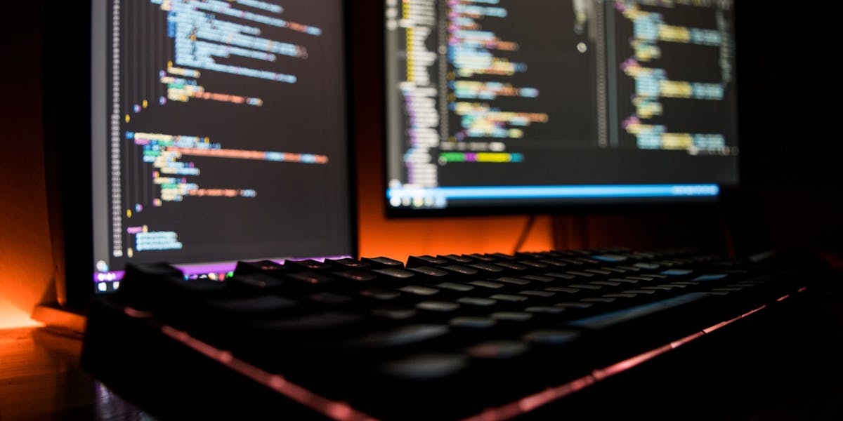 laptop and dekstop screens with code