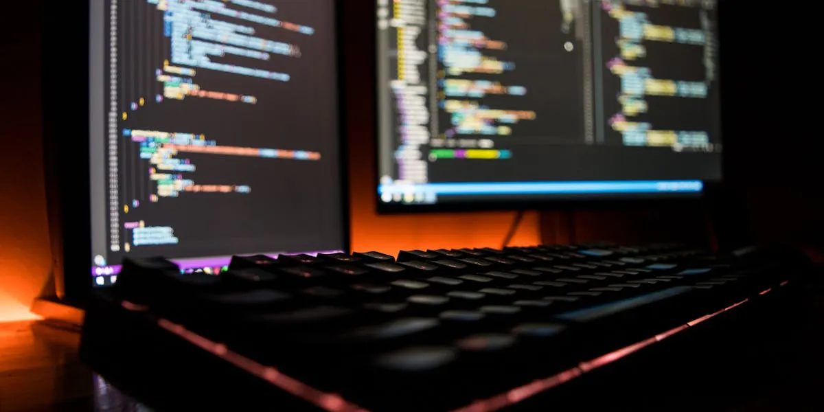 laptop and dekstop screens with code
